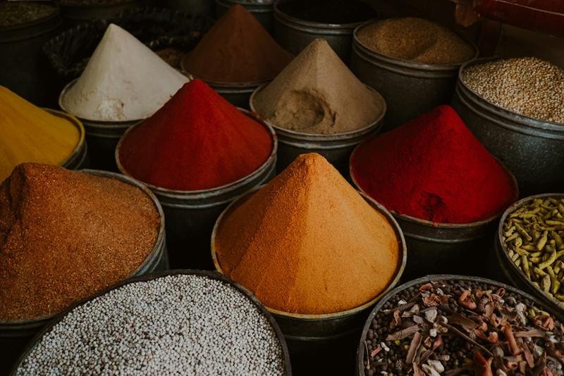 Cones of colourful ground spices and vegetable powders