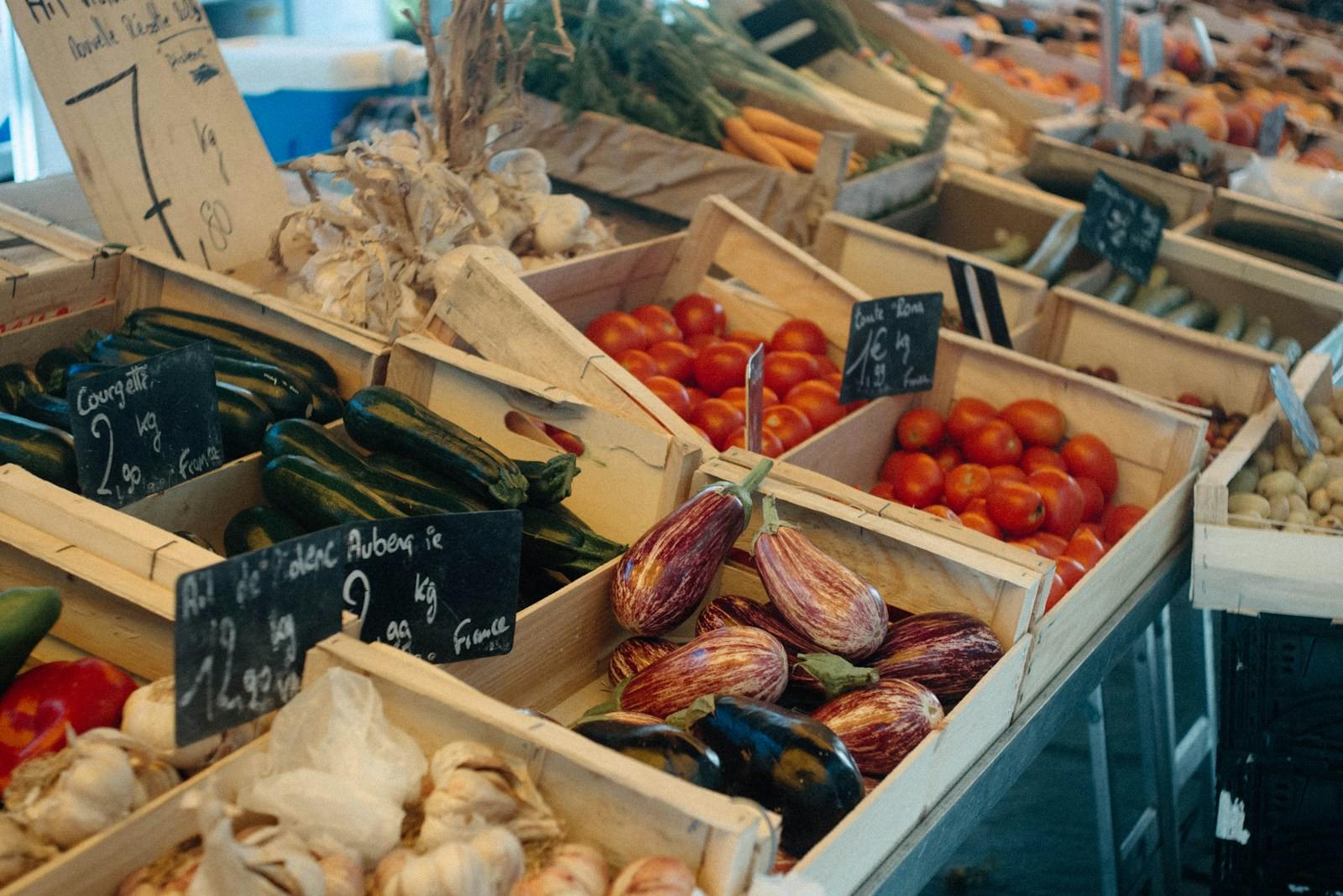 Crates of fresh vegetables on display at a market